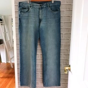 Calvin Klein • Men's Light/Medium Wash Distressed Bootcut Denim Jeans